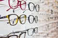 Selection of branded eyeglasses in an optician retail shop in Poland.