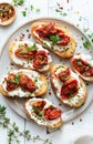 Gourmet Bruschetta With Roasted Tomatoes and Fresh Basil on a White Plate Royalty Free Stock Photo