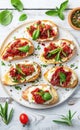 Gourmet Bruschetta With Roasted Tomatoes and Fresh Basil on a White Plate Royalty Free Stock Photo