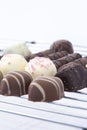 Selection of chocolates on a metal cooling rack.