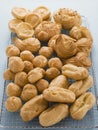 Selection of Choux Pastry Buns on a Cooling Rack Royalty Free Stock Photo