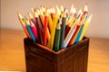 Selection of colored sharpened pencils standing upright in a box Royalty Free Stock Photo
