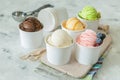 Selection of colorful ice cream scoops in paper cones Royalty Free Stock Photo