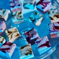 Selection of decorative desserts on buffet table at catered event