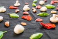 Selection of different Italian food ingredients against black background Royalty Free Stock Photo