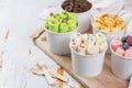 Selection of different rolled ice creams in cone cups Royalty Free Stock Photo