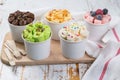 Selection of different rolled ice creams in cone cups Royalty Free Stock Photo