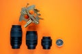 DSLR camera lenses alongside a nautical sextant and compass