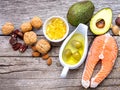 Selection food sources of omega 3 and unsaturated fats. Super foods high vitamin e and dietary fiber for healthy food on wooden Royalty Free Stock Photo