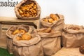 Selection of Fresh baked bread baskets and paper bags with bread roasted in the oven, croissants Royalty Free Stock Photo