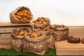 Selection of Fresh baked bread baskets and paper bags with bread roasted in the oven, croissants Royalty Free Stock Photo