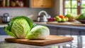 A selection of fresh vegetable: cabbage, sitting on a chopping board against blurred kitchen background copy space Royalty Free Stock Photo