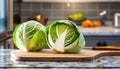 A selection of fresh vegetable: cabbage, sitting on a chopping board against blurred kitchen background copy space Royalty Free Stock Photo