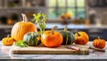 A selection of fresh vegetable: pumpkin, sitting on a chopping board against blurred kitchen background copy space