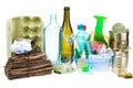 A selection of garbage for recycling. Segregated metal, plastic, paper and glass on white background