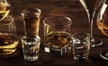 Selection of hard strong alcoholic drinks in big glasses and small shot glass in assortent: vodka, cognac, tequila, brandy and Royalty Free Stock Photo