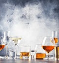 Selection of hard strong alcoholic drinks in big glasses and small shot glass in assortent: vodka, rum, cognac, tequila, brandy Royalty Free Stock Photo