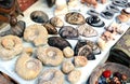 Selection of head masks and ammonite on a traditional Moroccan market in Marrakech, Morocco