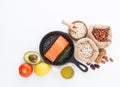 Selection of healthy food. Salmon fish, nuts, pepper, fruits and Royalty Free Stock Photo