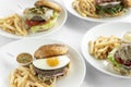 Selection of many different burgers on restaurant table Royalty Free Stock Photo
