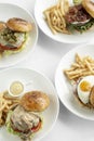 Selection of many different burgers on restaurant table Royalty Free Stock Photo