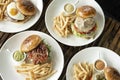Selection of many different burgers on restaurant table Royalty Free Stock Photo
