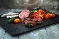 Selection of marinaded meat for bbq grilling with herbs on table