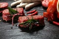 Selection of marinaded meat for bbq grilling with herbs on table