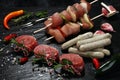 Selection of marinaded meat for bbq grilling with herbs on table