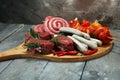 Selection of marinaded meat for bbq grilling with herbs on table