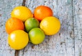 Three citrus fruits grouped on the floor