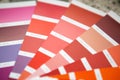 Selection of the paint color for decorative home repairs to the palette with layouts. A fan of shades in your hand inside the home