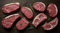 Selection of raw beef steaks and lamb chops with rosemary and peppercorns on a dark table Royalty Free Stock Photo