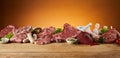 Selection of raw meats on rustic timber board Royalty Free Stock Photo