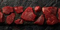 A selection of raw marbled beef cuts displayed on a textured black slate background. Perfect for carnivore diet concepts or Royalty Free Stock Photo