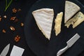 Selection of semi-soft cheeses on a board Royalty Free Stock Photo