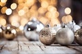 A selection of silver christmas tree ornaments on a distressed wooden table