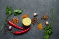 Selection of spices, herbs on black stone table. Ingredients for cooking. Food background. Royalty Free Stock Photo