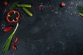 Selection of spices herbs and greens. Ingredients for cooking. Food background on black slate table. Royalty Free Stock Photo