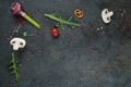 Selection of spices herbs and greens. Ingredients for cooking. Food background on black slate table. Royalty Free Stock Photo