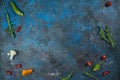 Selection of spices herbs and greens. Ingredients for cooking. Food background on black slate table. Royalty Free Stock Photo