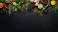 Selection of spices herbs and greens, ingredients for cooking over dark background Royalty Free Stock Photo