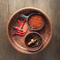 Selection of spices pepper. Food background on black wood table Royalty Free Stock Photo