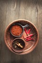 Selection of spices pepper. Food background on black wood table. Royalty Free Stock Photo