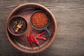 Selection of spices pepper. Food background on black wood table. Royalty Free Stock Photo