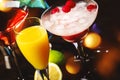 Selection of summer cocktails. Cold refreshing alcoholic beverages and drinks: mimosa, cosmopolitan, raspberry margarita and blue Royalty Free Stock Photo