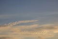 Dramatic golden blue sunset or sunrise with spotted cumulus clouds.