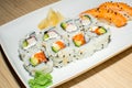 A selection of sushi rolls with salmon, tuna, cucumber and soy sauce dip Royalty Free Stock Photo