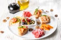 Selection of tasty bruschetta or canapes on taosted baguette and quark cheese topped with smoked salmon, shrimp. Royalty Free Stock Photo