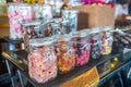 Selection of tasty sweet candies in the glass jars on the table in the buffet